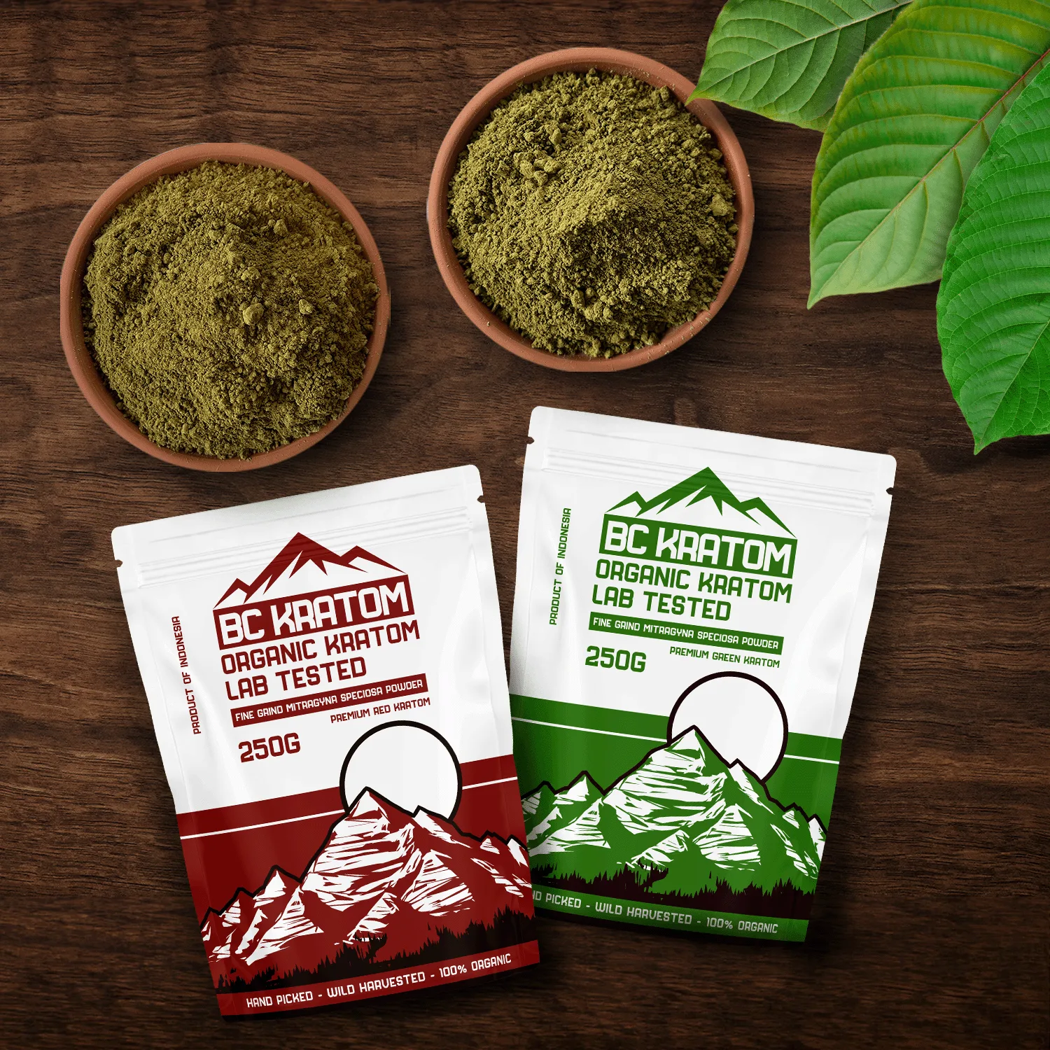 2x 250g BC Kratom bags laying on a wooden table beside two bowls of kratom powder