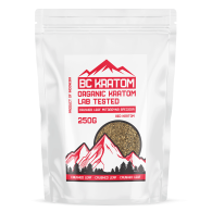 Red crushed leaf kratom contained in a white stand up pouch. The bag has red text and red mountain logo