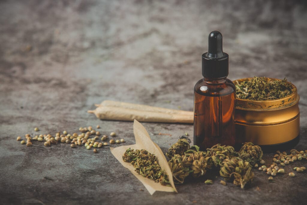 metal-grinder-weed-canabis-oil-joint-posing