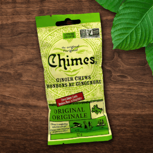 Original Ginger Chimes small candy pouch laid down on a wooden table with leaves.